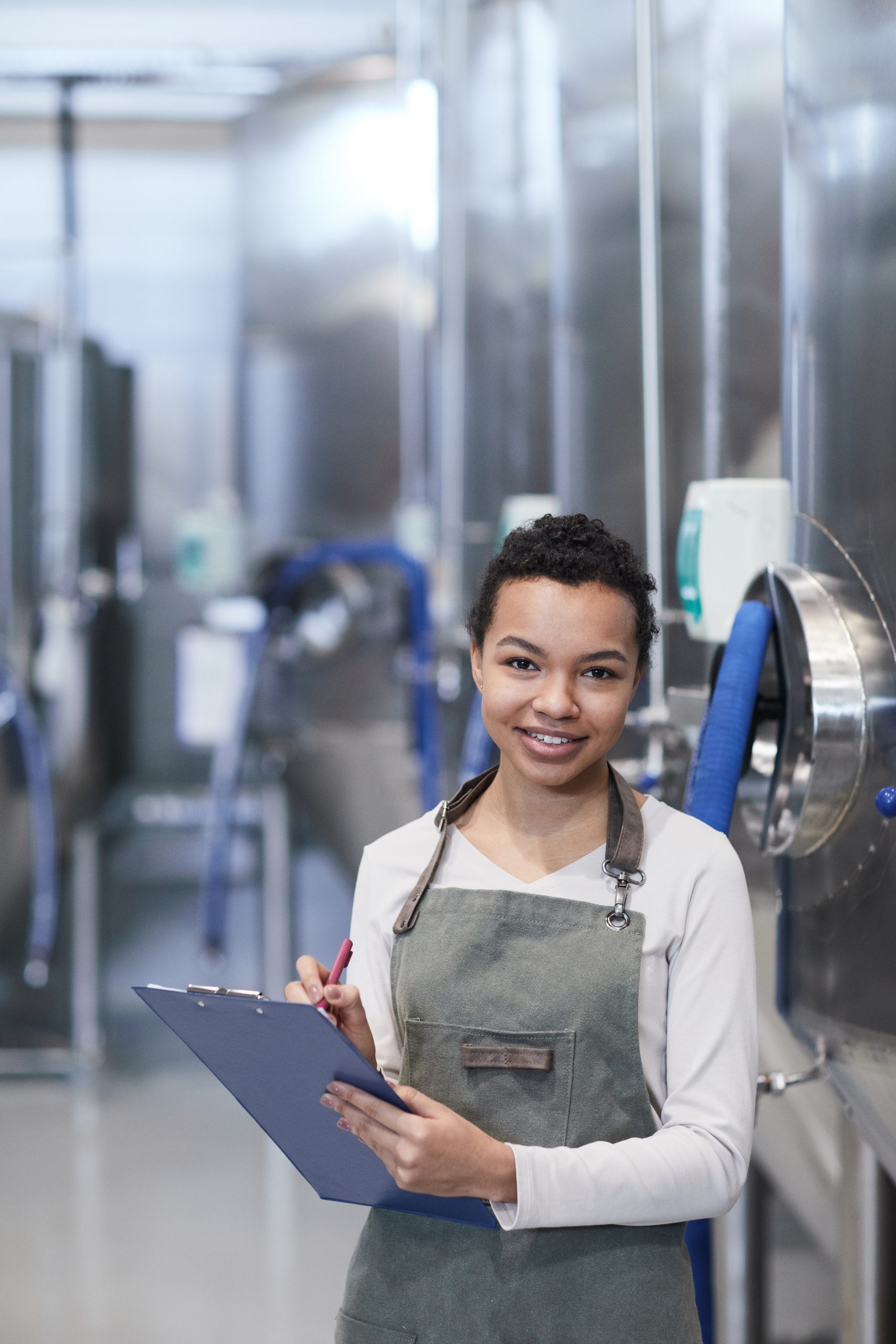Smiling African-American Woman Working at Food Factory