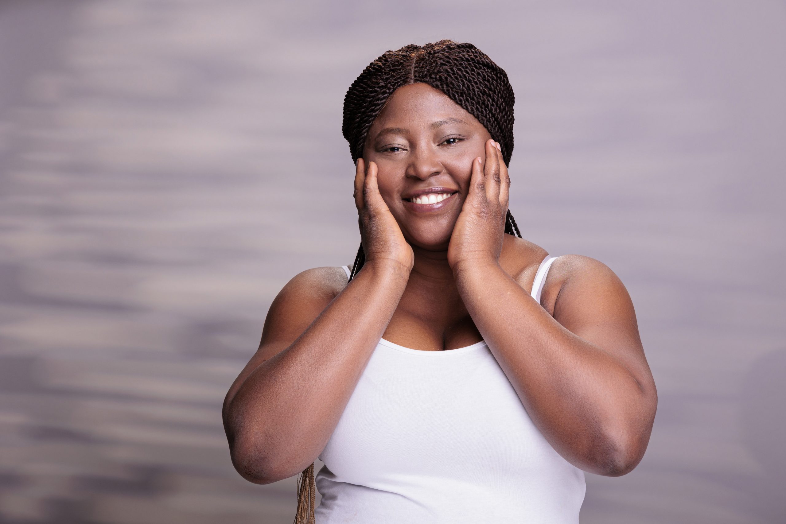 Smiling plus size woman making face washing gesture portrait
